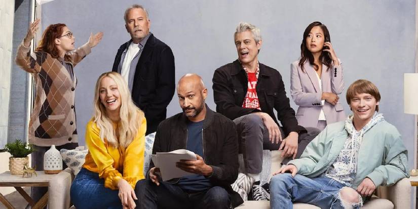 The full cast of 'Reboot' (2022) together around a couch.