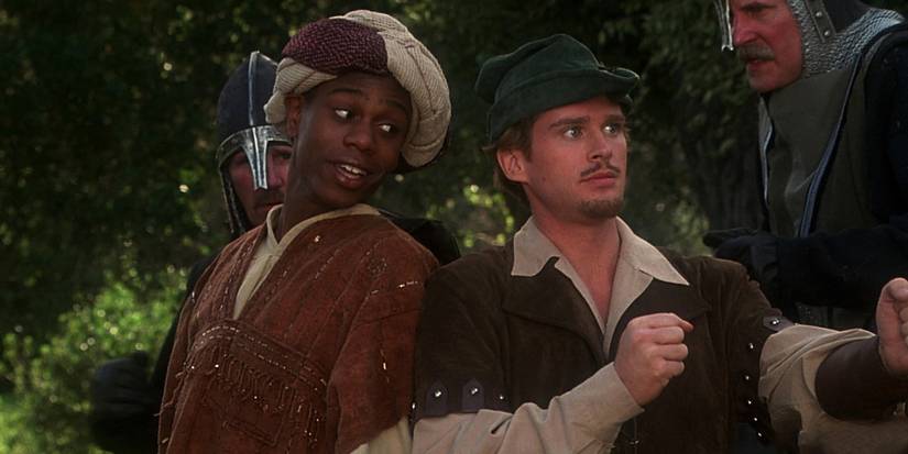Dave Chappelle as Ahchoo and Cary Elwes as Robin Hood back to back in Robin Hood: Men in Tights.