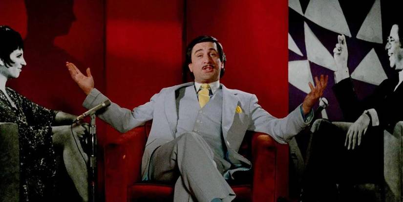 Rupert Pupkin spreading his arms while on a talk show in 'The King of Comedy.'