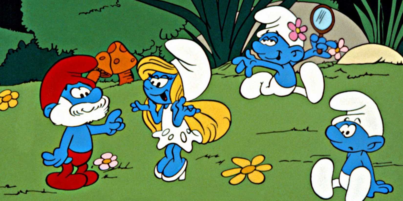 The characters in The Smurfs frolic in a field of flowers