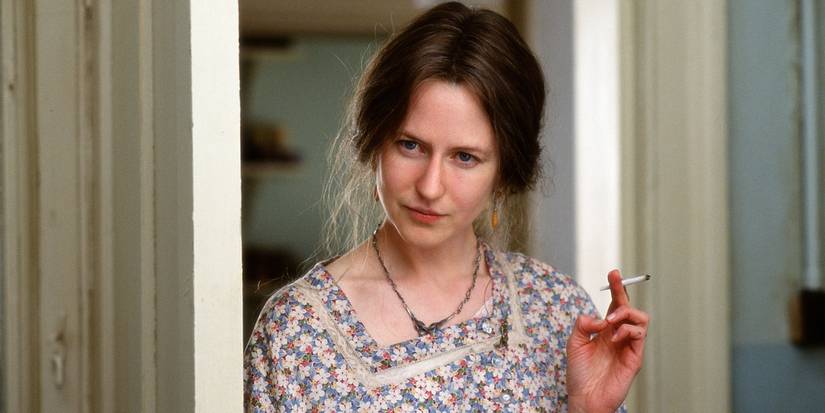 Nicole Kidman as Virginia Woolf with a cigarette leaning against a doorway in 2002's The Hours. 