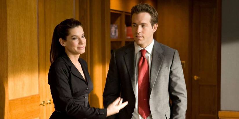 Sandra Bullock and Ryan Reynolds in the office in The Proposal 