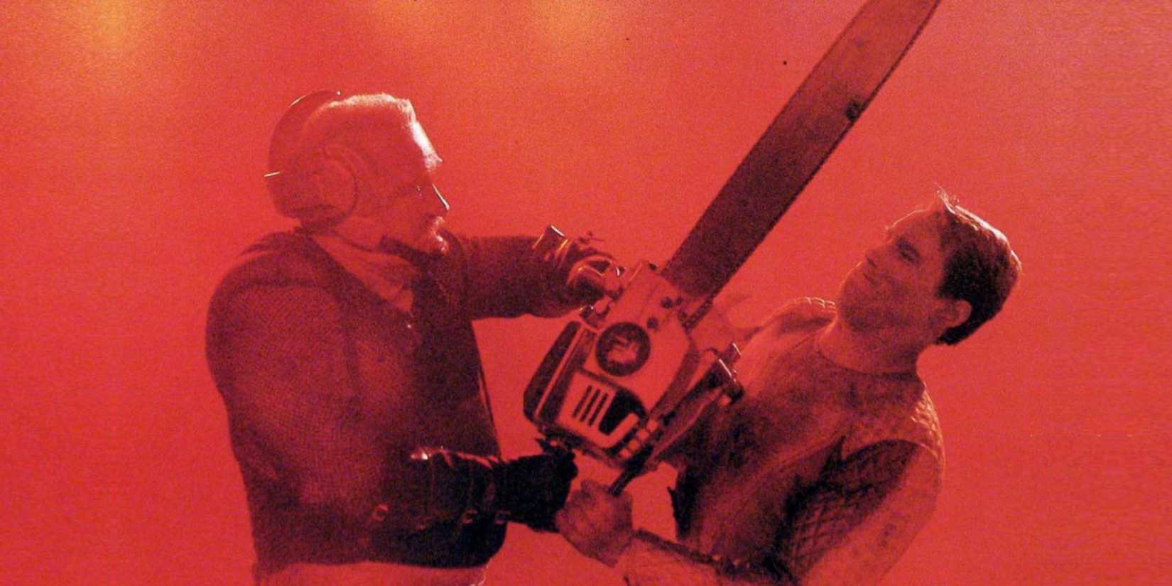Arnold Schwarzenegger's Ben Richards fighting a chainsaw man in The Running Man 
