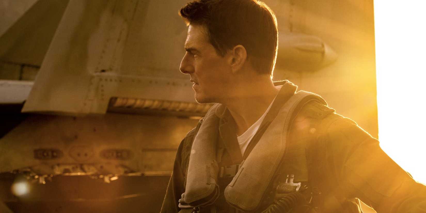 The sun sweeps in as veteran fighter pilot Pete "Maverick" Mitchell stands before his aircraft in 'Top Gun: Maverick'.