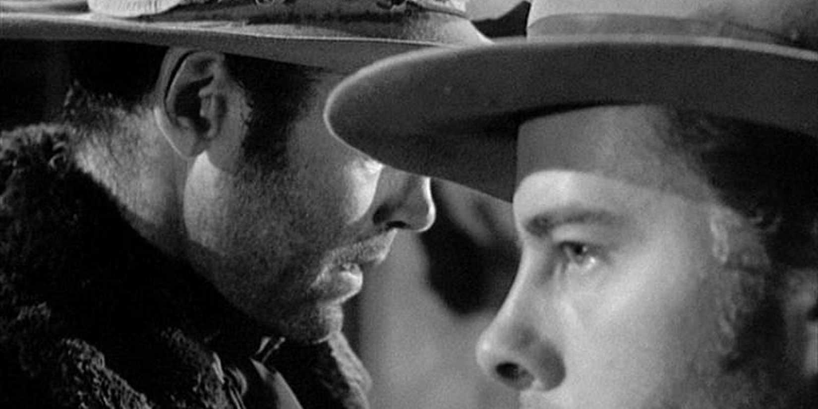 Henry Fonda and Harry Morgan looking in opposite directions in The Ox-Bow Incident, 1943.