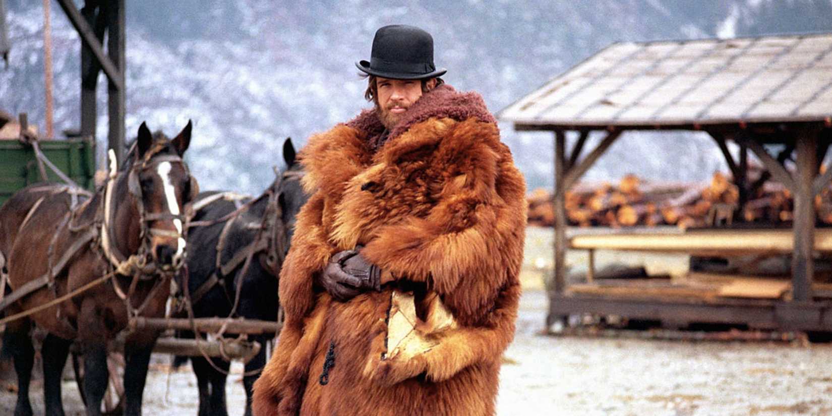 John McCabe covered in fur looking directly at the camera in 'McCabe & Mrs. Miller'