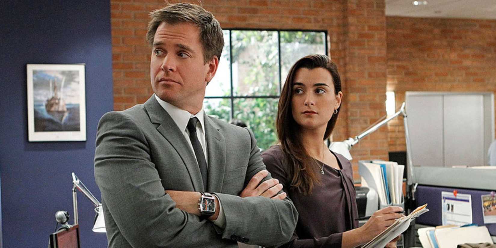 Ziva David (Pablo De Cote) and Tony DiNozzo (Michael Weatherly) standing next to each other and looking to the side in NCIS.