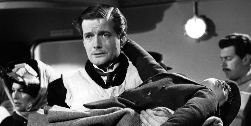 Robbie Lucas, played by John Merivale, carrying an unconscious passenger in A Night to Remember