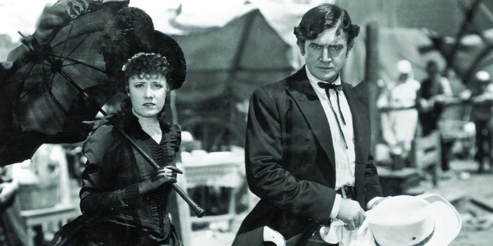 A man and a woman looking directly at the camera in Cimarron - 1931