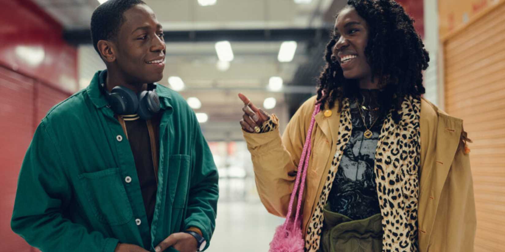 Dom and Ya standing in a hallway in Rye Lane