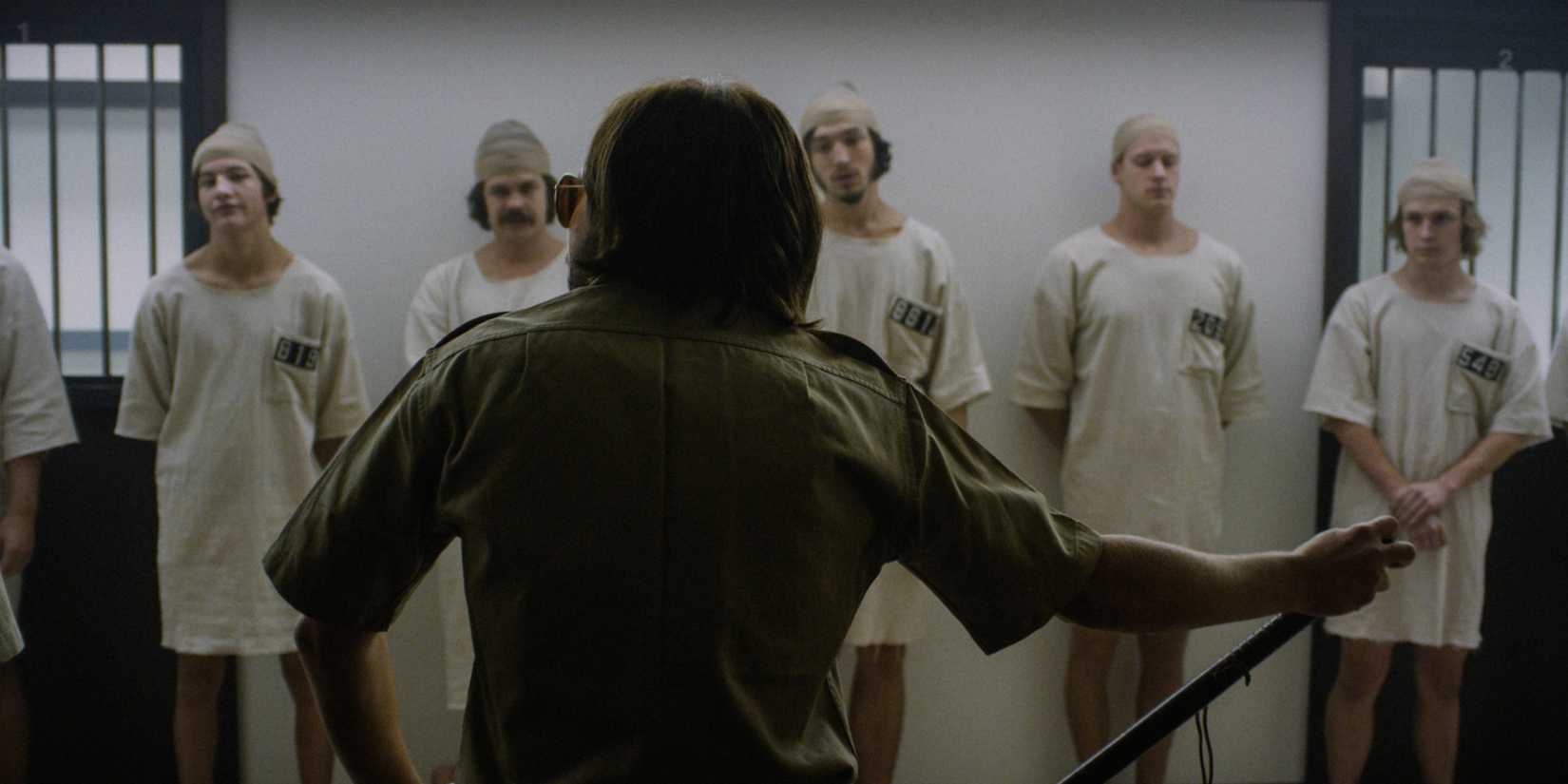 The inmates listen to the guard in 'The Stanford Prison Experiment' (2015)