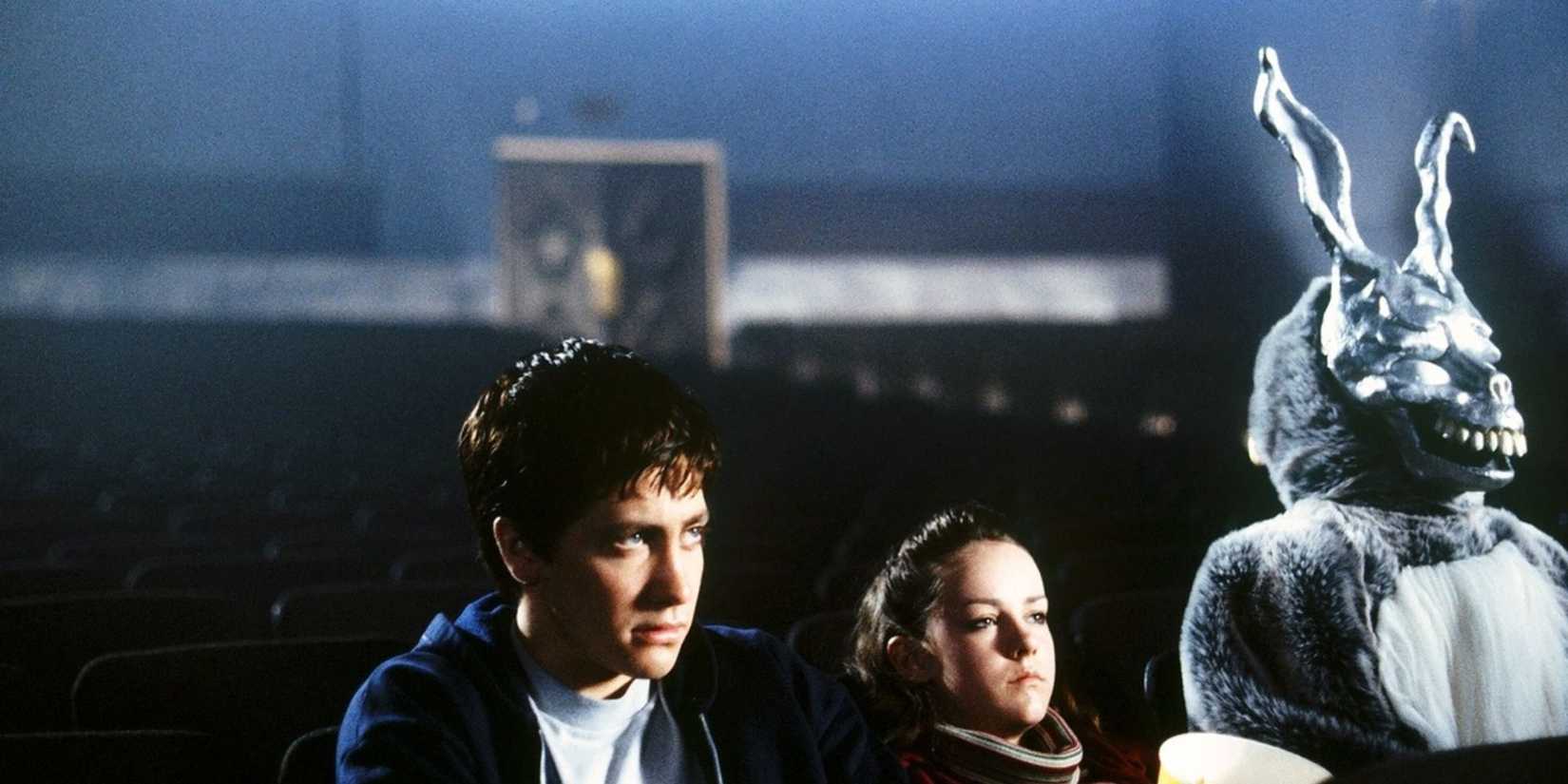 Jake Gyllenhaal sitting in a movie cinema in 'Donnie Darko'