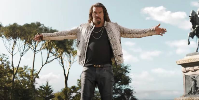Jason Momoa as Dante stands with his arms outstretched in Fast X.