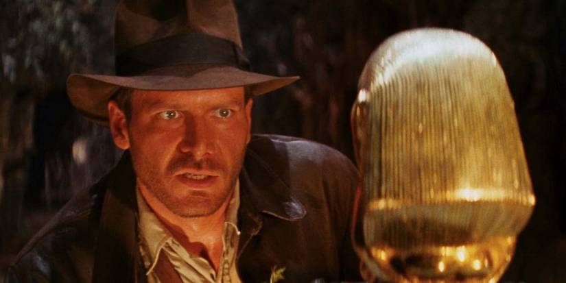Indiana Jones, played by Harrison Ford, eyes a golden idol in 'Raiders of the Lost Ark'.