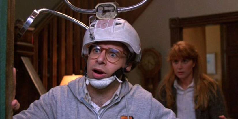 Wayne Szalinski wearing a helmet and looking confused while answering the door in Honey, I Shrunk the Kids
