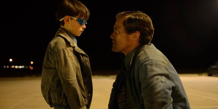 Roy kneeling down to talk to Alton in Midnight Special