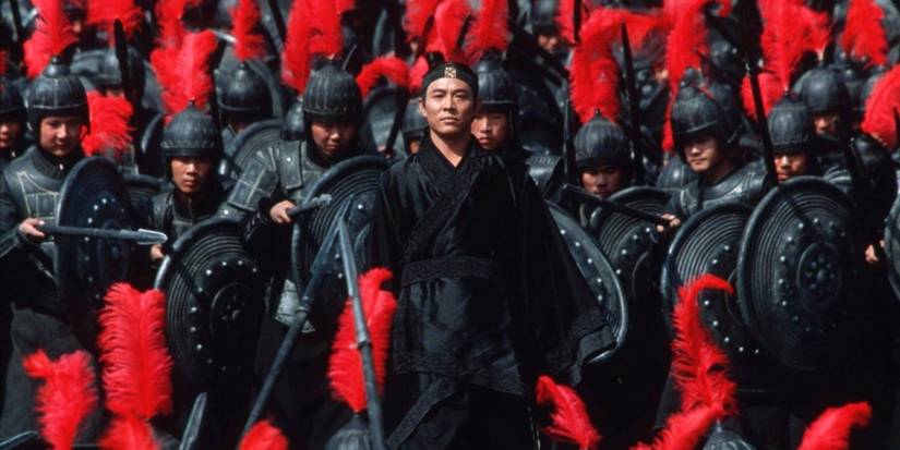 Jet Li in 'Hero' standing in front of soldiers with red feathers.
