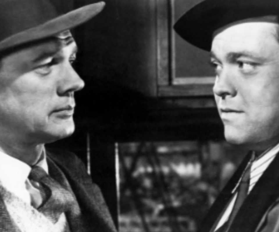 Joseph Cotten looking at Orson Welles, neither trusting the other, in The Third Man