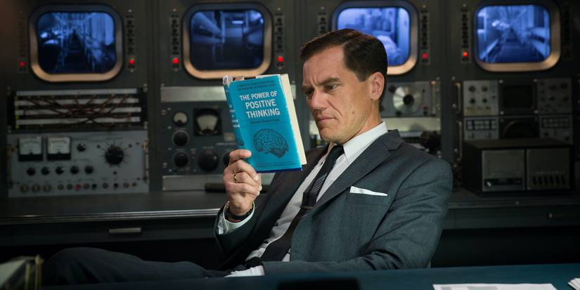 Richard Strickland reading a book in The Shape of Water