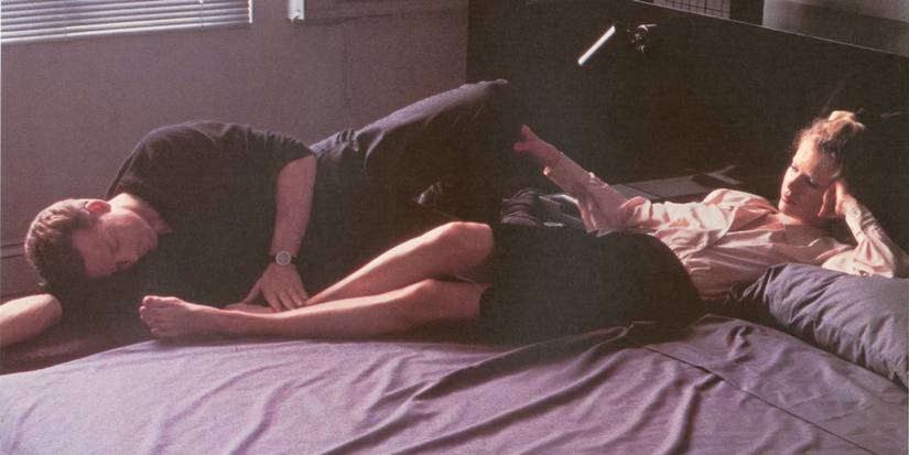 Mickey Rourke and Kim Basinger asJohn and Elizabeth lying on a bed in 9 1/2 Weeks