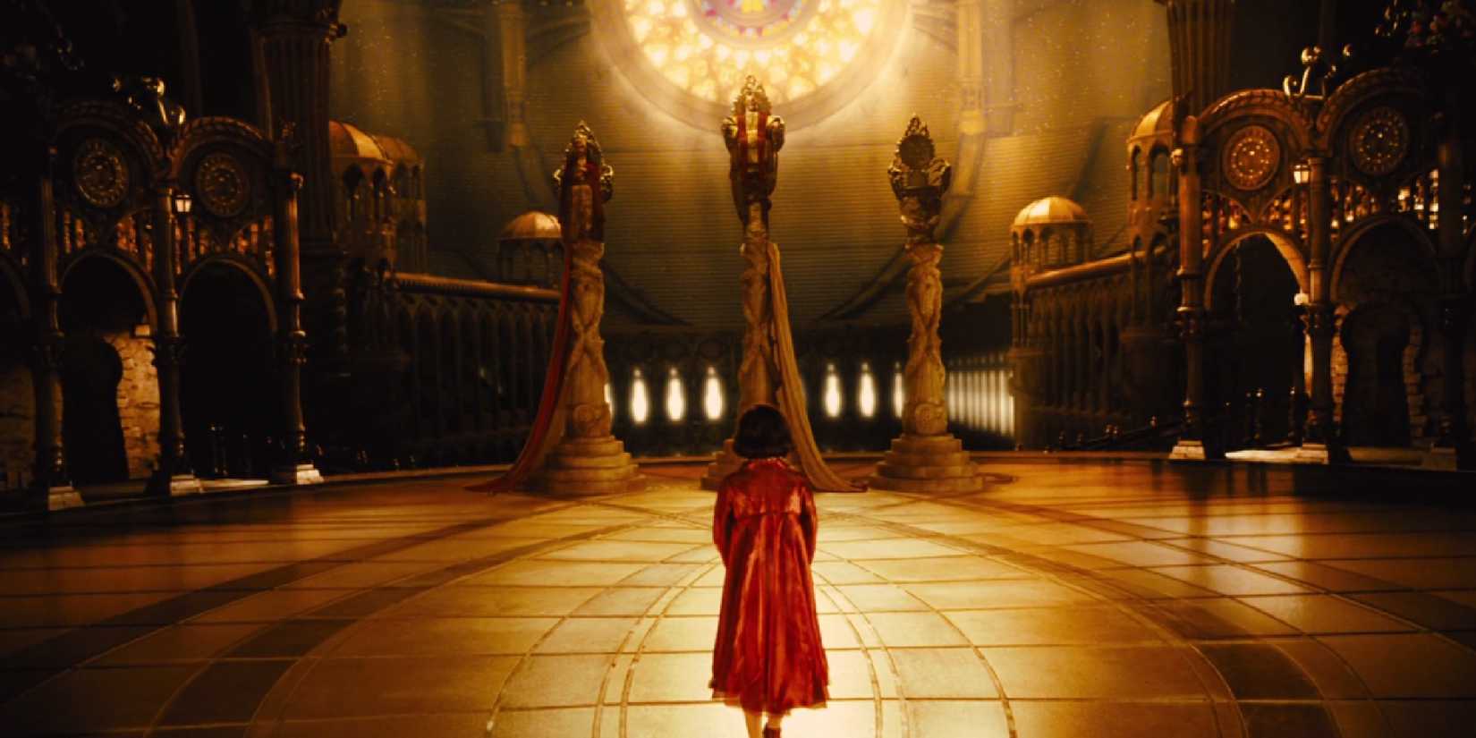 Ofelia standing in a large room in Pan's Labyrinth
