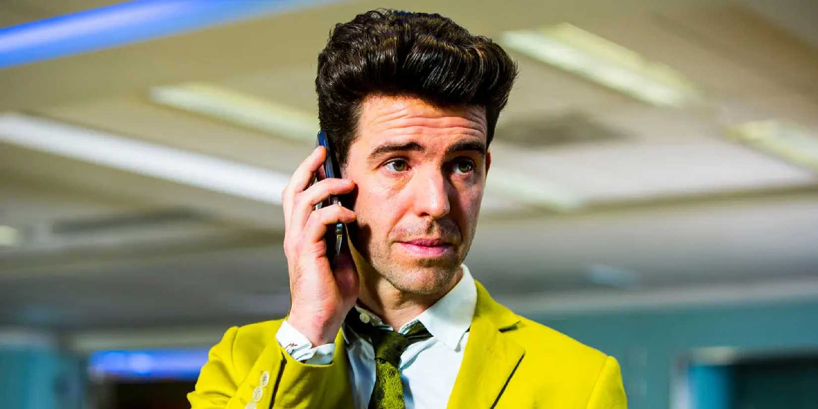Paul Ready speaking on the phone in 'Utopia'