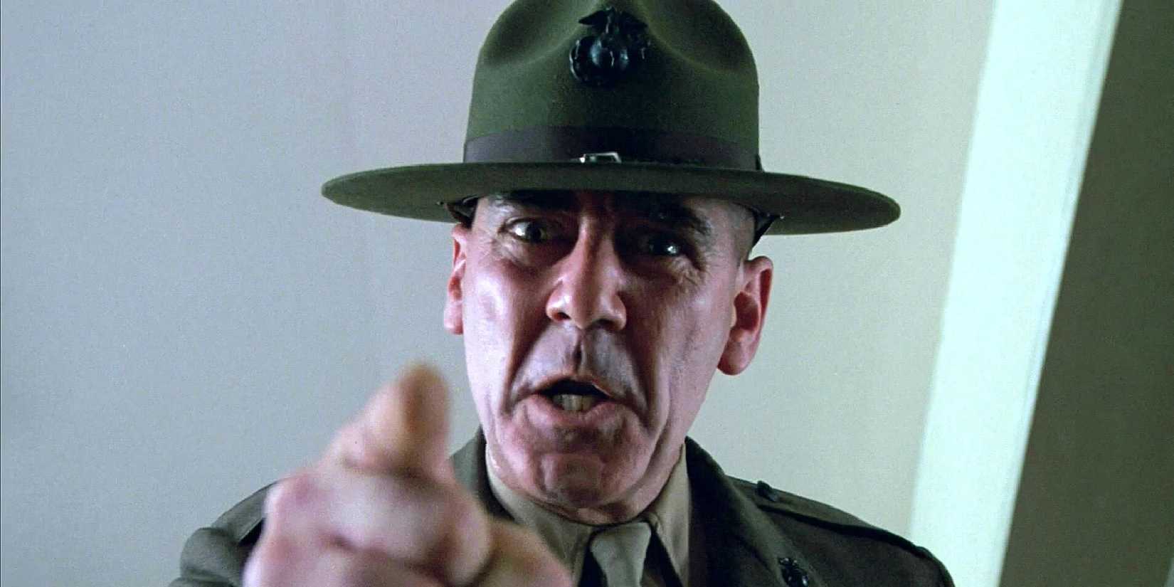 R. Lee Ermey as Gunnery Sergeant Hartman, pointing a finger at the camera in 'Full Metal Jacket'