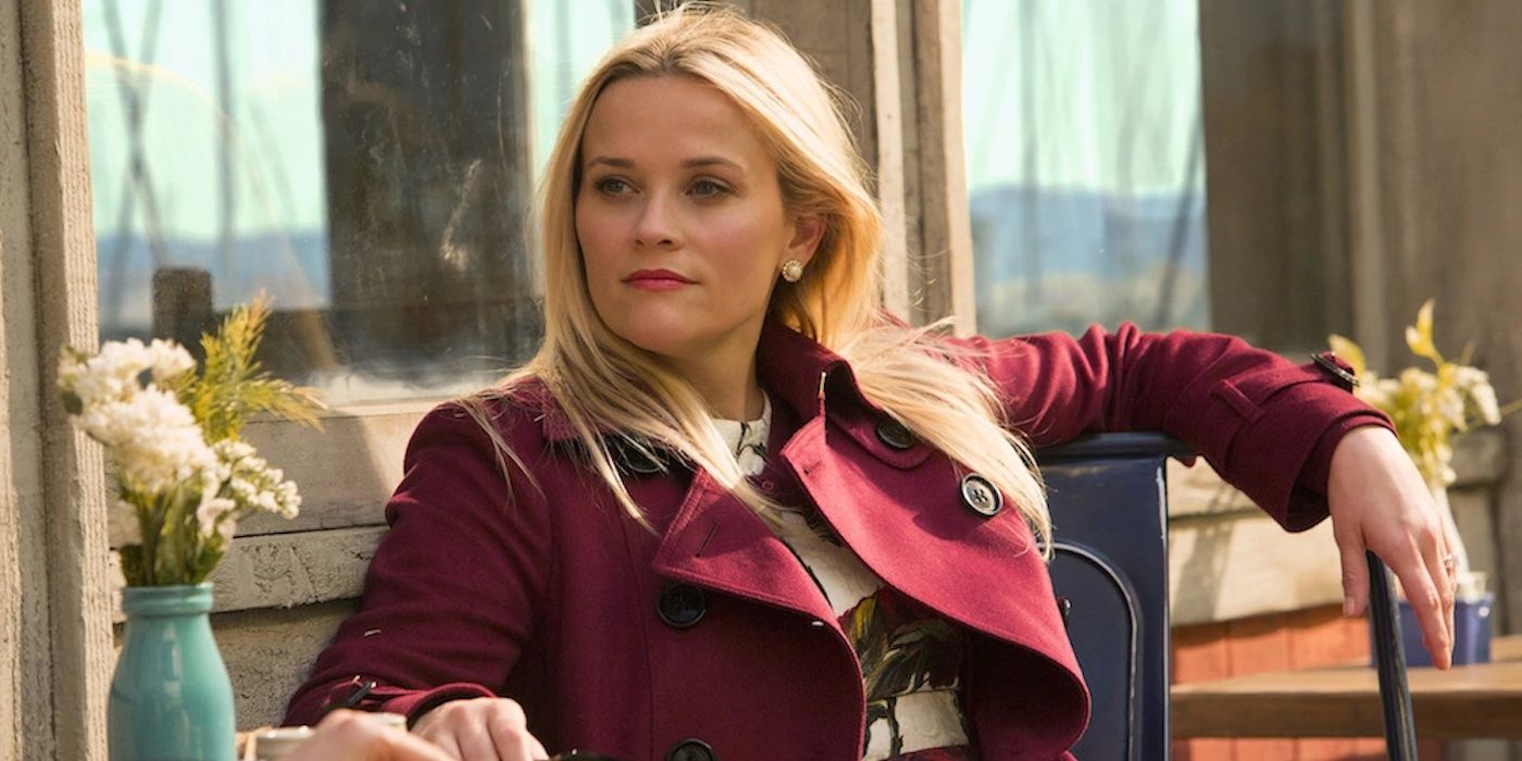 Reese WItherspoon in Big Little Lies sitting at an outdoors cafe.