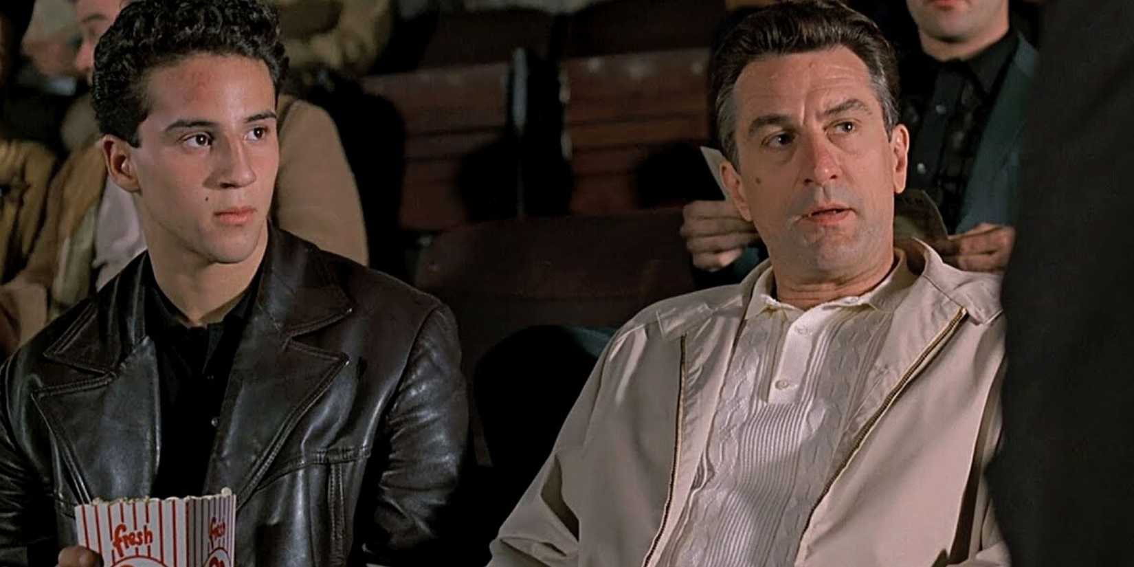 Robert De Niro sitting next to Lillo Brancato in a theater in A Bronx Tale.