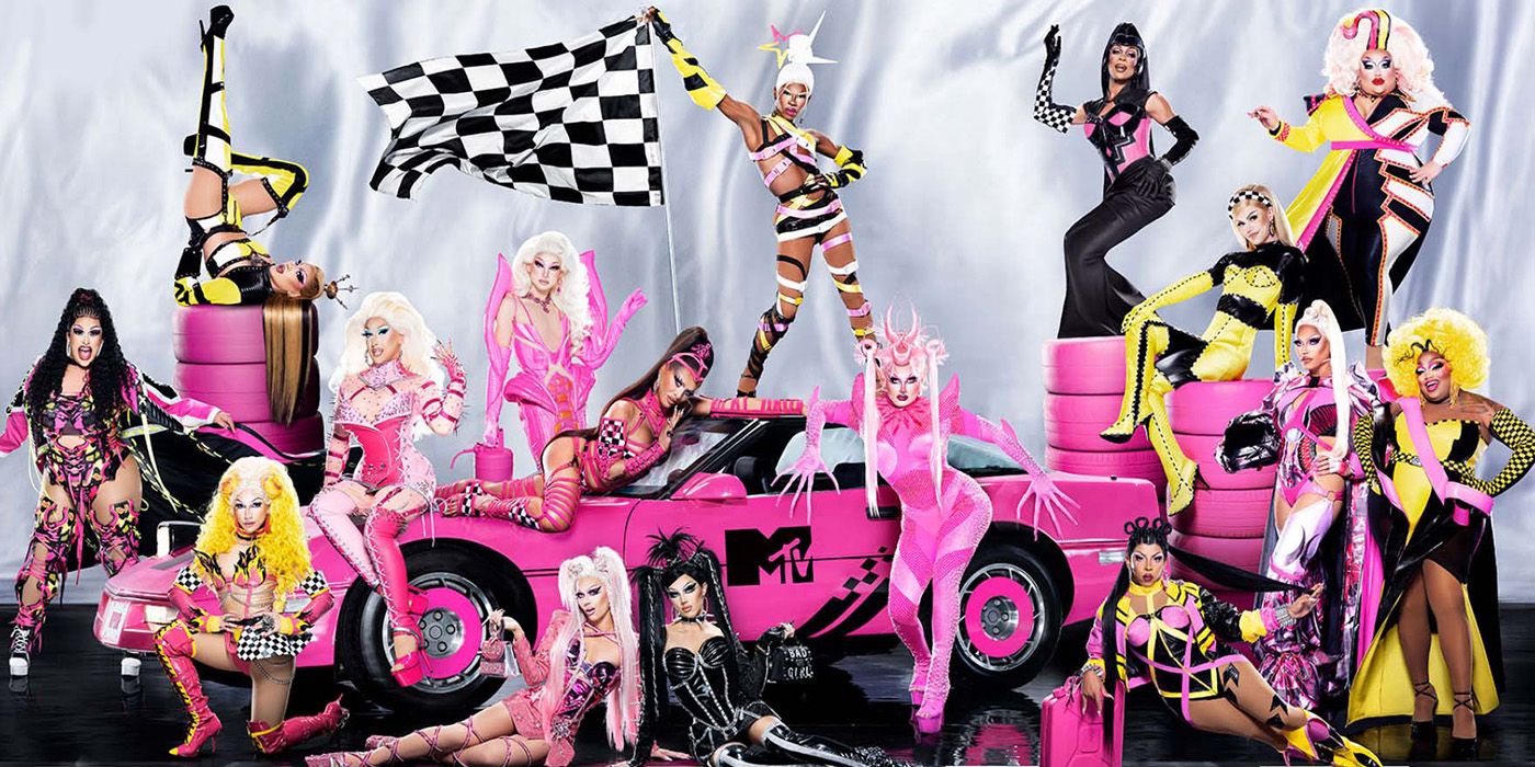 The cast of RuPaul's Drag Race Season 15 pose in Racing gear with a race car