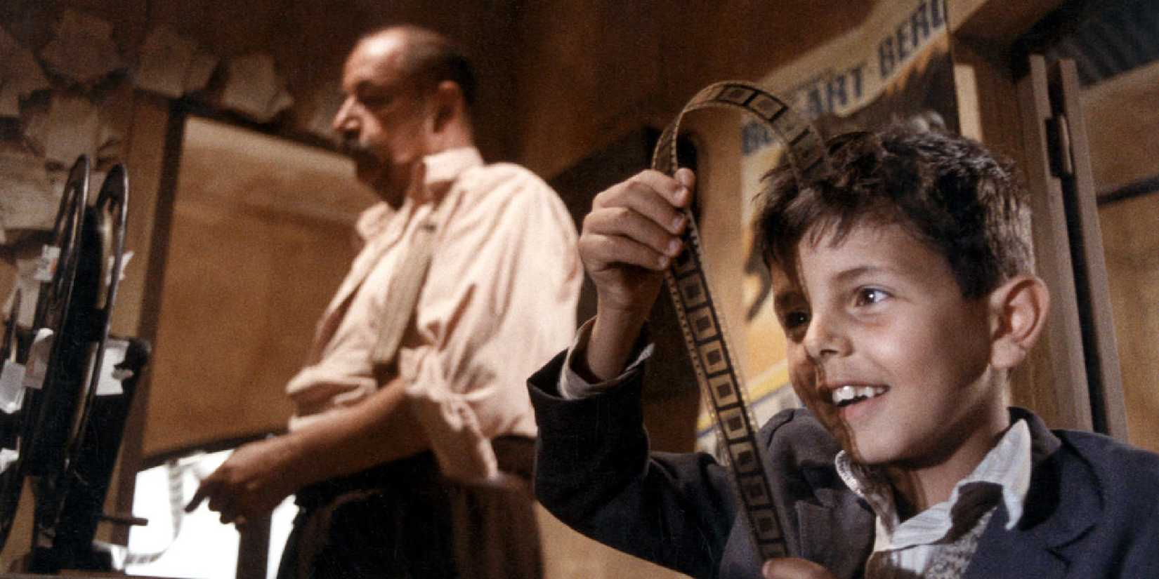 Salvatore Cascio as Salvatore looking at developed film roll in 'Cinema Paradiso'