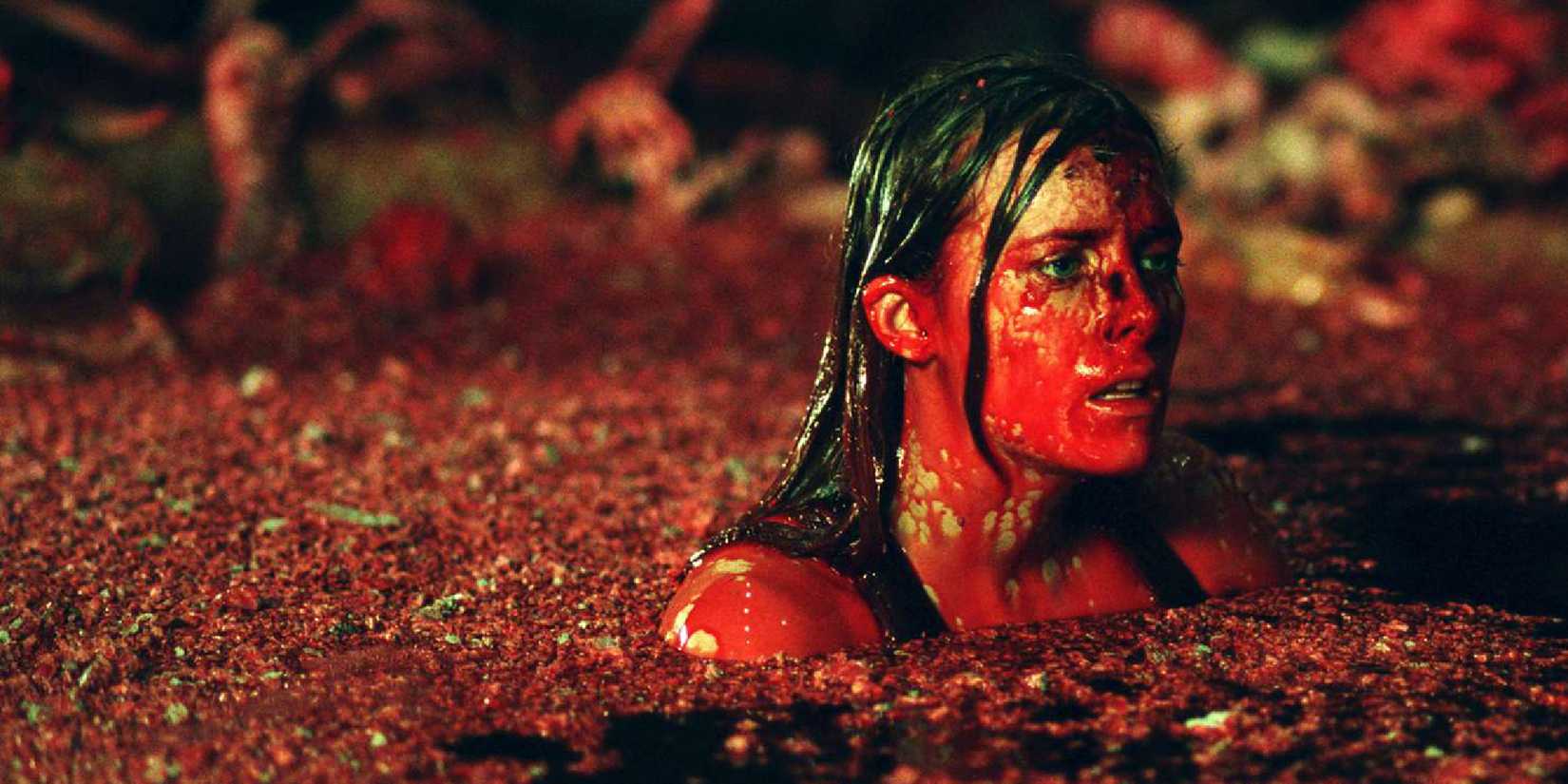 Shauna Macdonald swimming in an horrifying pool of red fluid in The Descent.