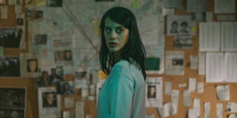Milena Smit looking back in front of an investigation board in the Netflix series The Snow Girl