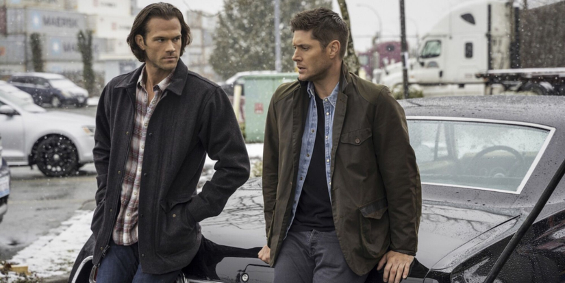 Jared Padalecki and Jensen Ackles sit on the hood of their car in Supernatural  
