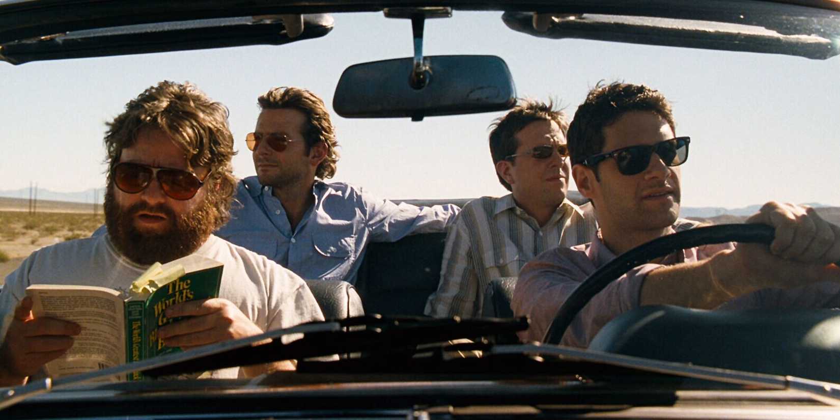 Justin Bartha, Zach Galifianakis, Ed Helms, and Bradley Cooper as Doug Alan Stu Phil driving a car in Las Vegas