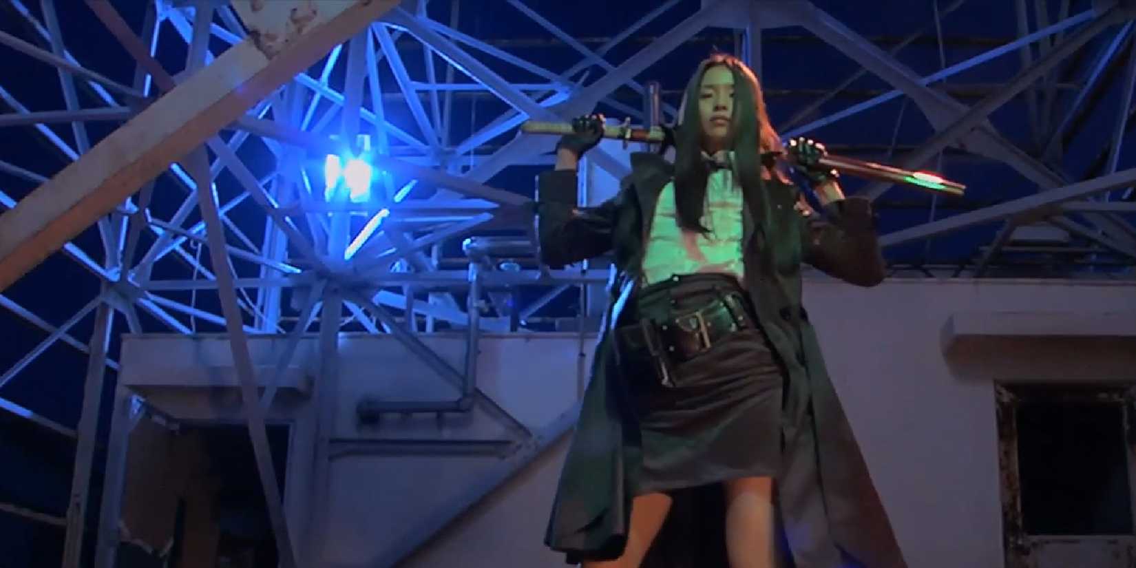 A woman posing with a katana behind her neck in Tokyo Gore Police - 2008