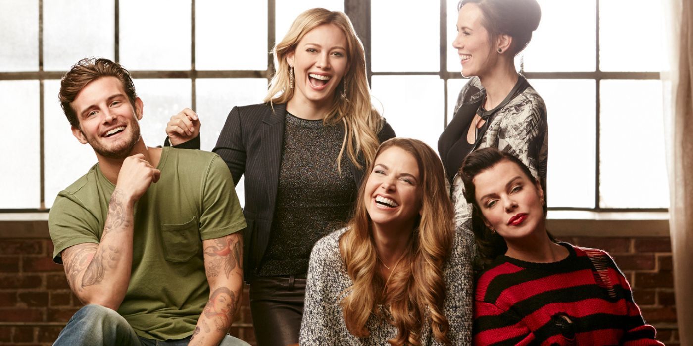 The Cast of Younger poses for a photo.