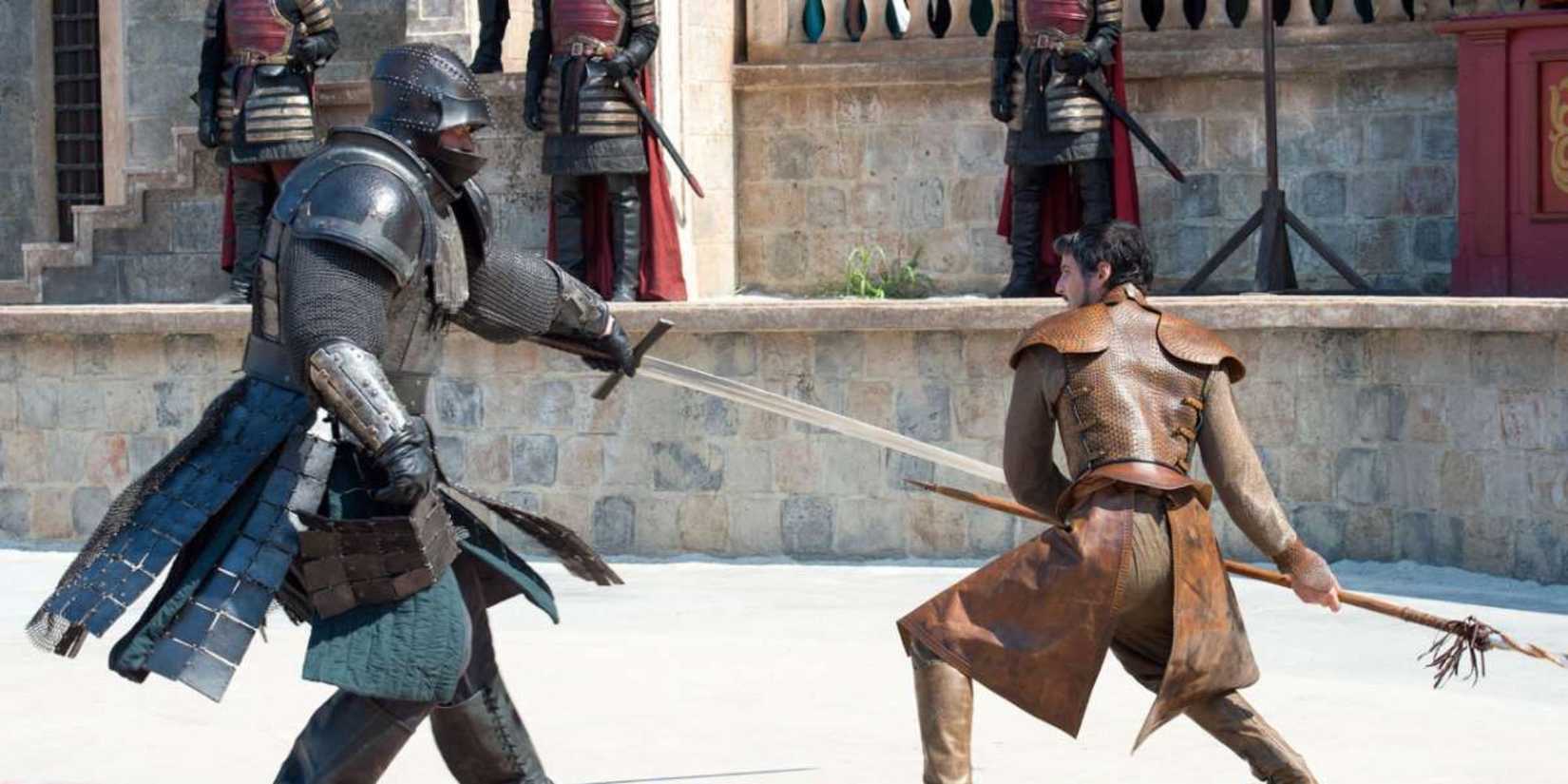 The Mountain and Oberyn Martell fight in a courtyard in Tyrion Lannister's trial by combat.