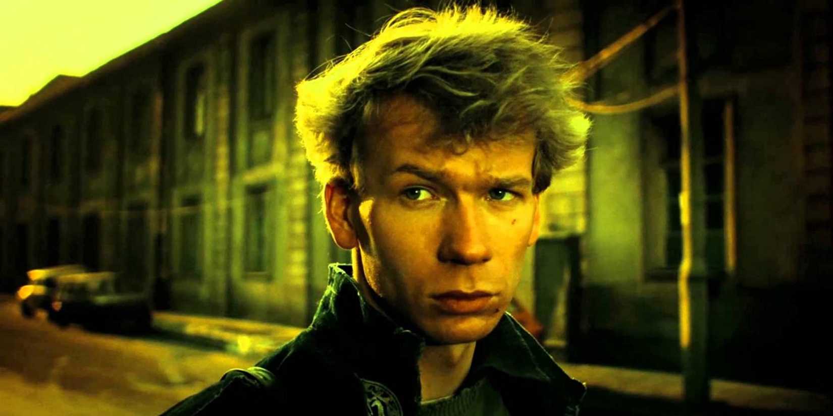 A young man looking to his side in the film A Short Film About Killing