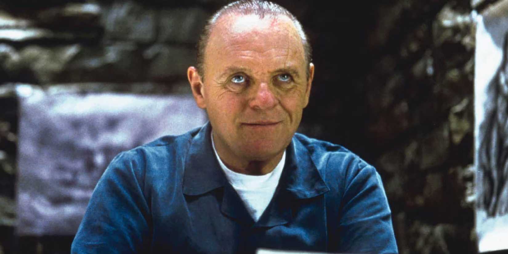Anthony Hopkins as Hannibal Lecter smirking inside his cell in Red Dragon