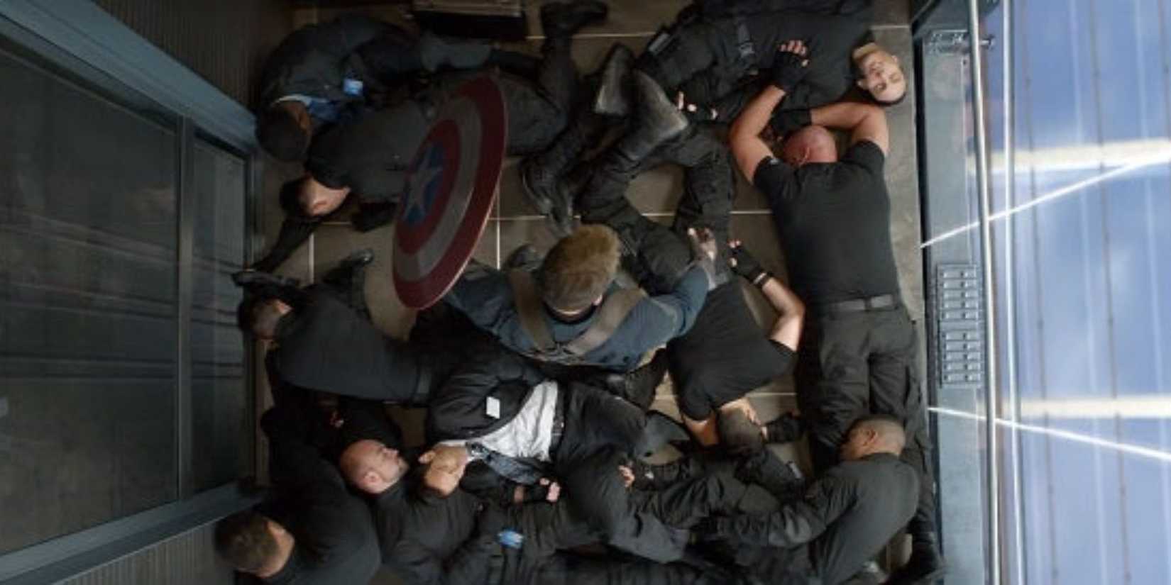 Captain America stands over the unconscious guards he fought in the elevator in Captain America: The Winter Soldier