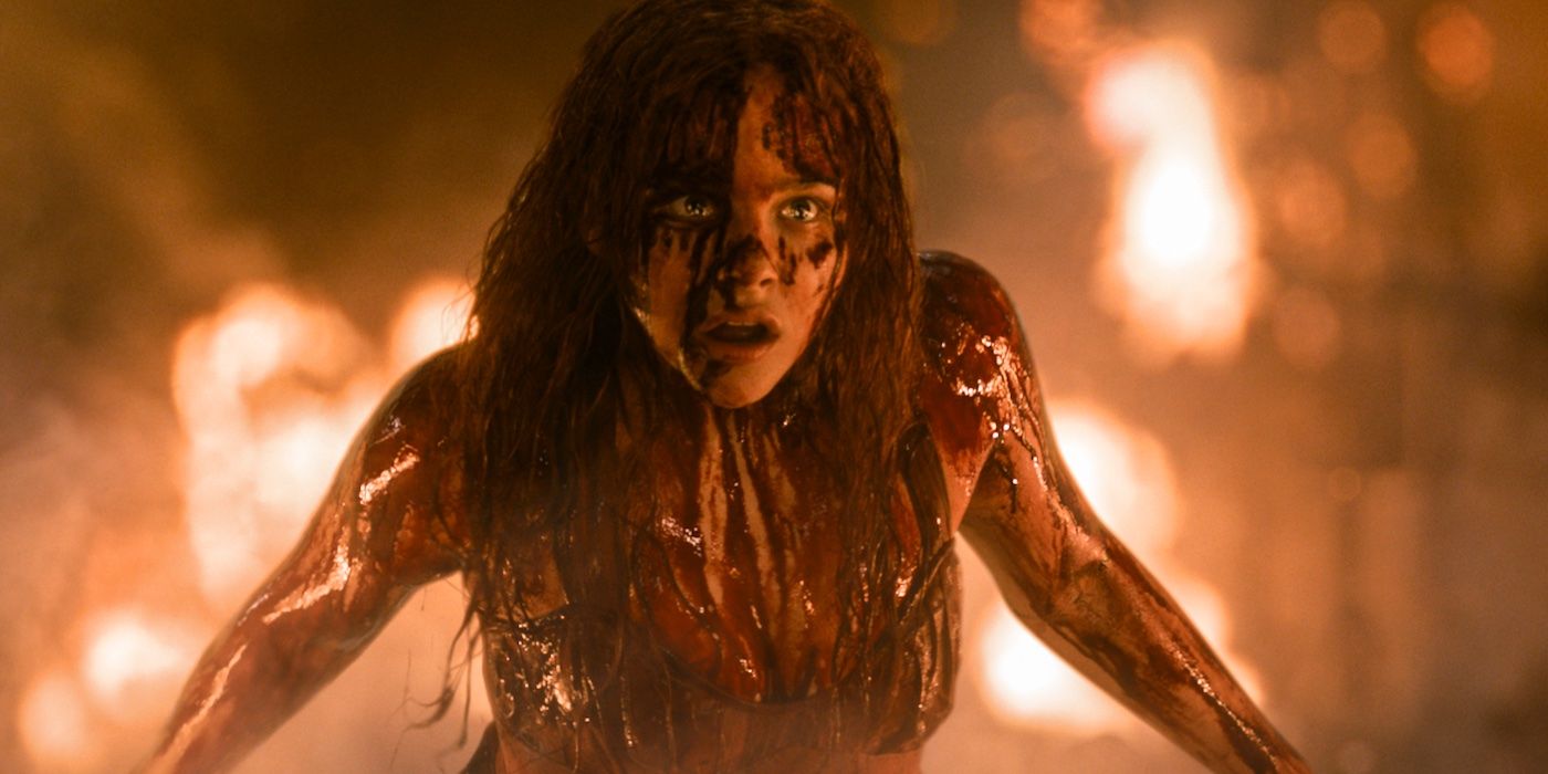Chloe Grace Moretz as Carrie, covered in blood and surrounded by flames, in 2013 Carrie remake