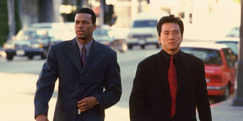 Chris Tucker as Detective James Carter and Jackie Chan as Inspector Lee walking side by side in Rush Hour