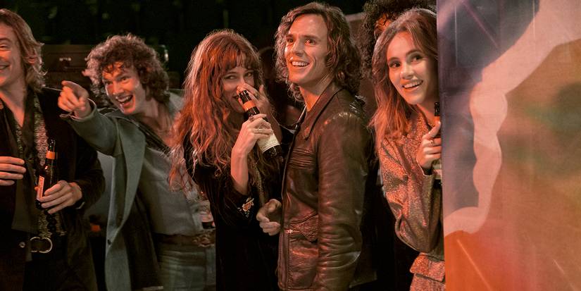 Daisy, Billy, Karen, in Daisy, and Graham laughing and looking in the same direction in Daisy Jones & The Six