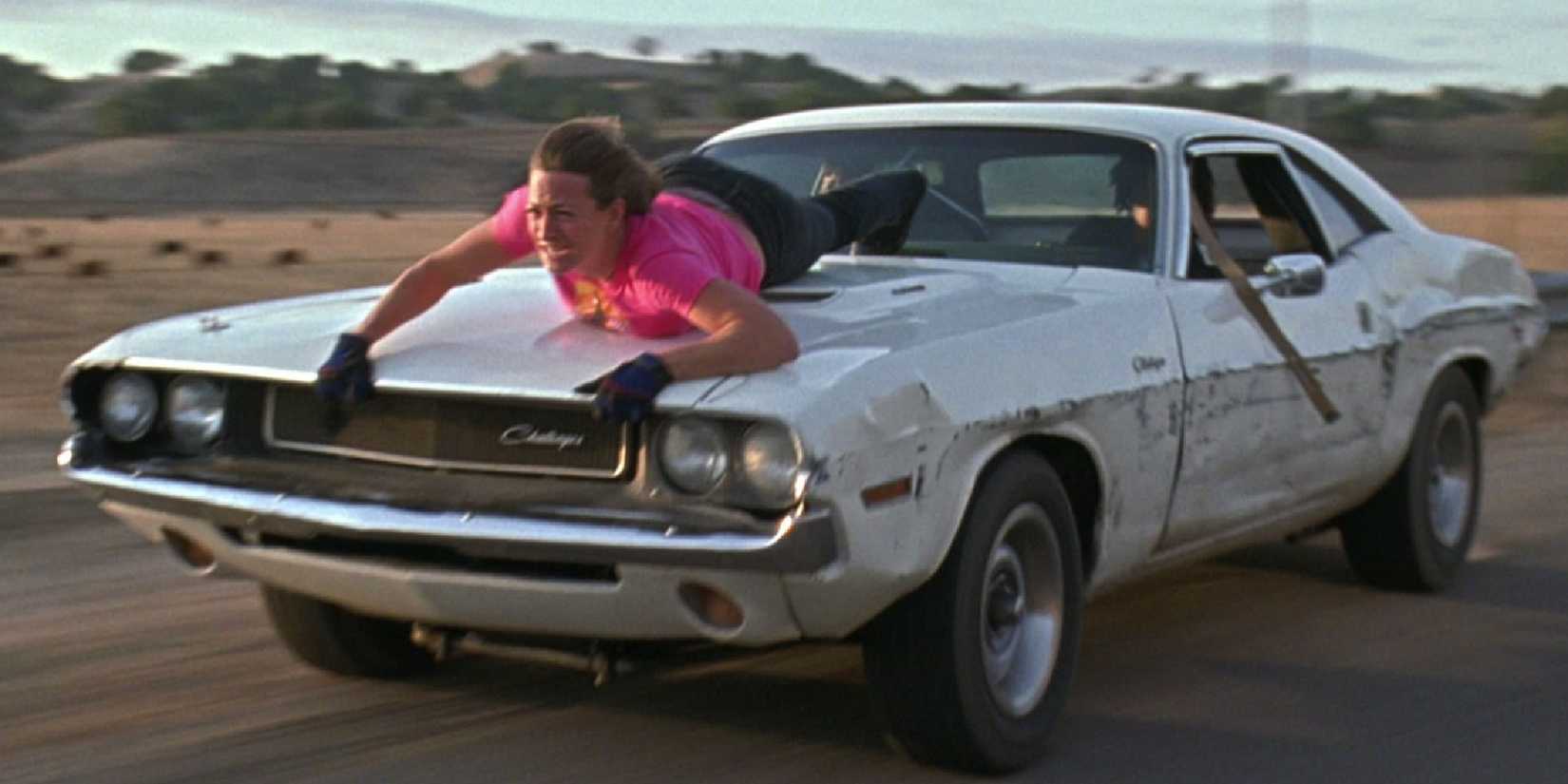 Mike McKay holding on to the hood of a moving car in Death Proof - 2007