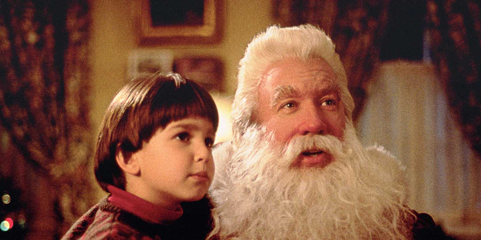 Eric Lloyd as Charlie and Tim Allen as Scott/Santa in The Santa Clause.