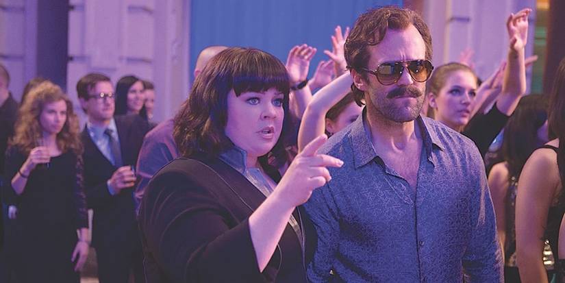 Jason Statham as Rick Ford and Melissa McCarthy Susan Cooper in disguise at a club in Spy