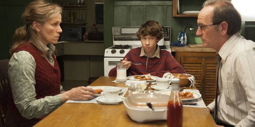 Frances McDormand and Richard Jenkins at the dinner table with their characters' son in Olive Kitteridge.