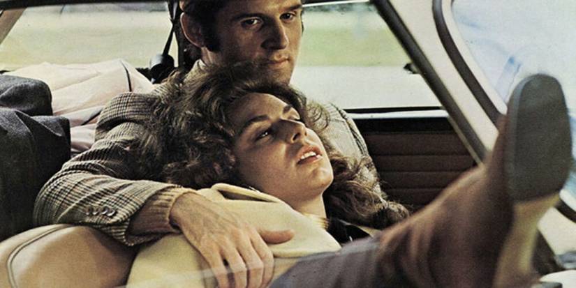 Lenny (Charles Grodin) and Lila (Jeannie Berlin) sitting in the car together in The Heartbreak Kid