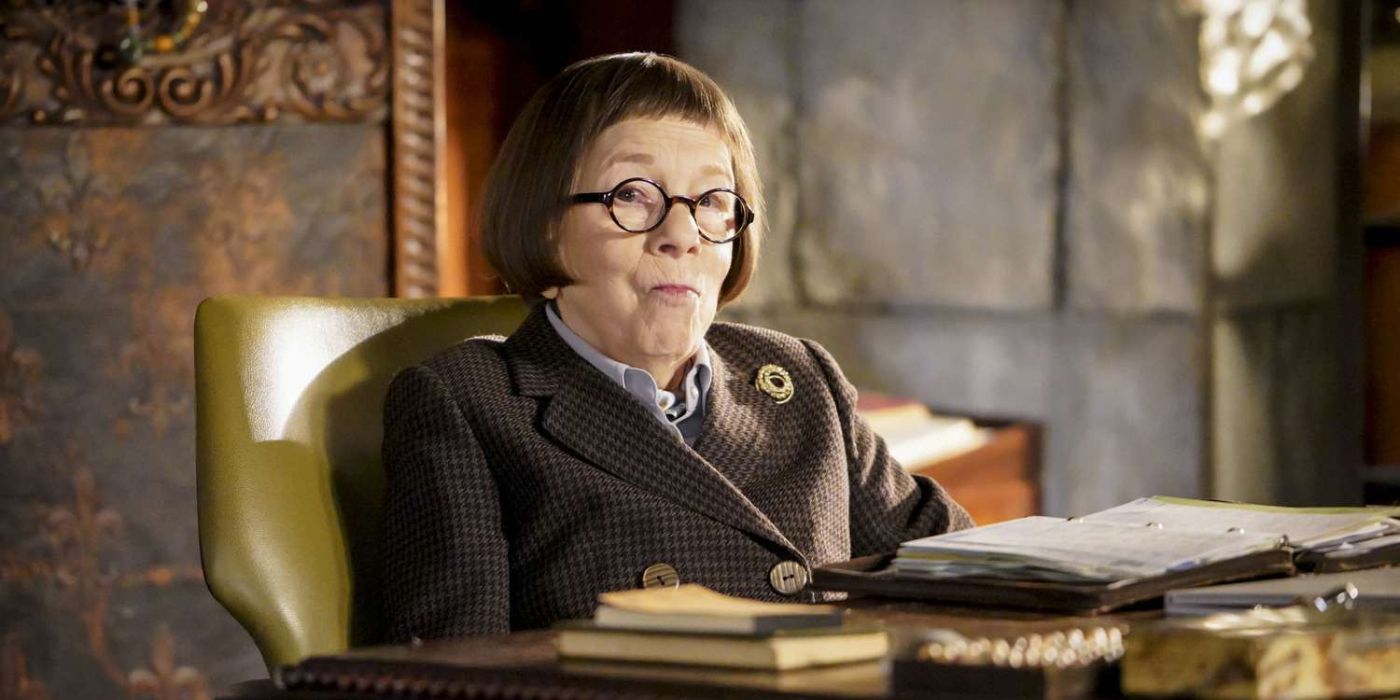 Linda Hunt as Hetty Lange sitting at her desk in NCIS: Los Angeles.